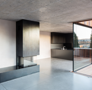 raumgestaltung neubau wohnhaus beton holz glasfronten schwarz modern küche rombach